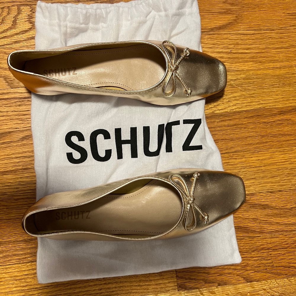 Brand new never worn Gold flats/ ballet flats